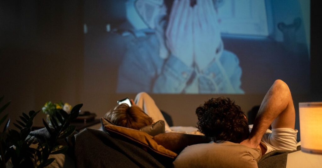 Person choosing among the best similar movies on a TV streaming app