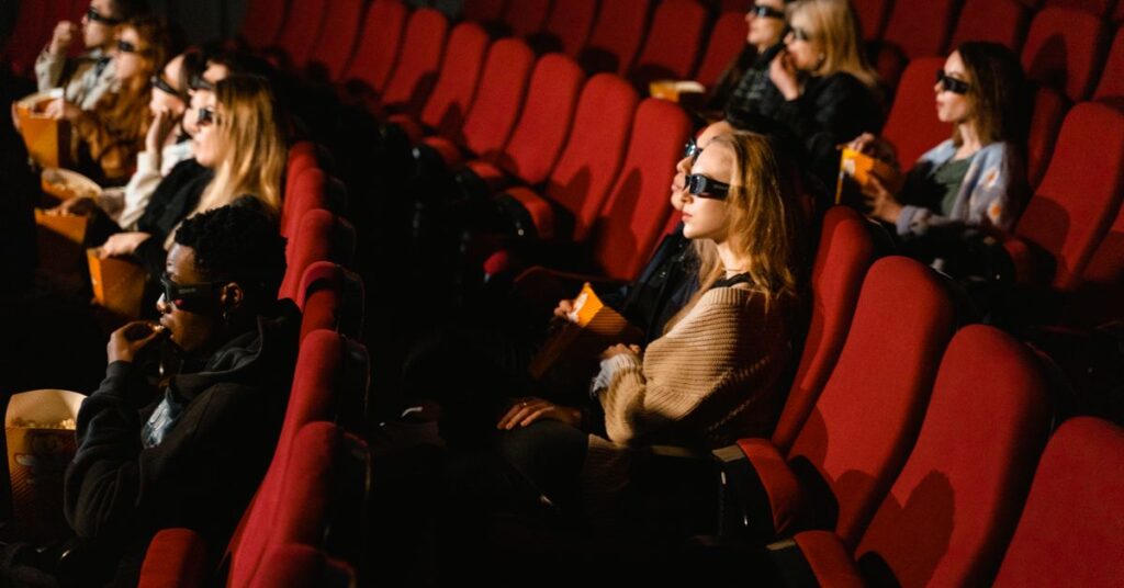 Upcoming Tamil movies: audience watching a film in a cinema hall